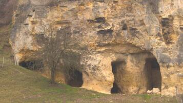 A natural rock formation with two caves.
