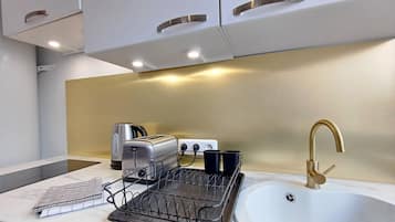 Fridge, microwave, stovetop, coffee/tea maker