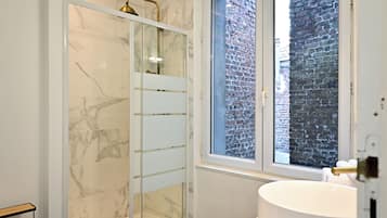 Shower, hair dryer, towels, soap