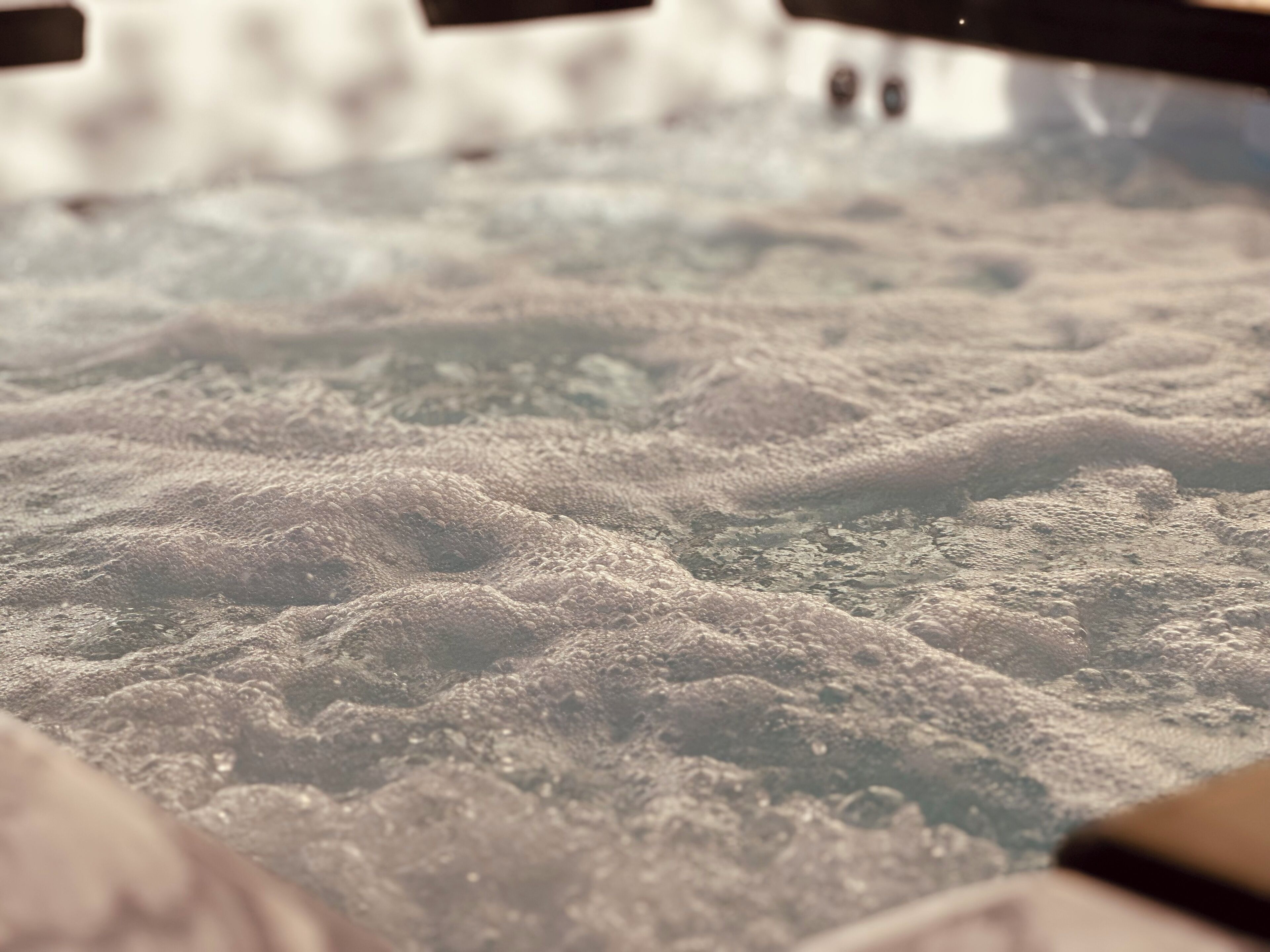 A close-up of a textured surface with a pattern of raised, irregular shapes.