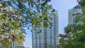 A park with a circular pavilion, steps leading up to it, and tall residential buildings in the background. - Mountain & Lake Views' Suite Cycas (Ipoh)