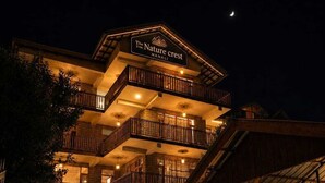 A multi-story hotel with a sign reading 'The Nature Crest.' - The Nature Crest Manali (Manali)