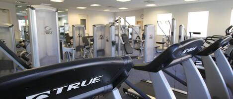 A gym with treadmills and weight machines.