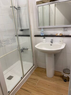 Shower, hair dryer, towels, soap