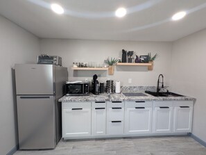 Fridge, microwave, stovetop, coffee/tea maker