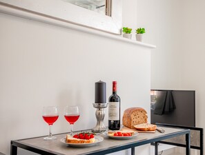 Enjoy a quiet evening in with a bottle of wine, a warm loaf of bread, and a simple meal.
