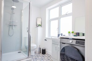 Shower, hair dryer, towels