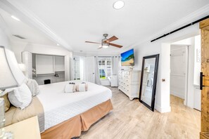 A bedroom with a bed, a ceiling fan, a dresser, and a TV. - Heated Pool! Waterfront+Kayak! Close 2 Beach! (Pompano Beach)