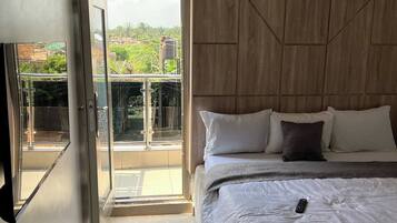 Junior Room, Balcony, City View | Desk, laptop workspace, blackout curtains, soundproofing