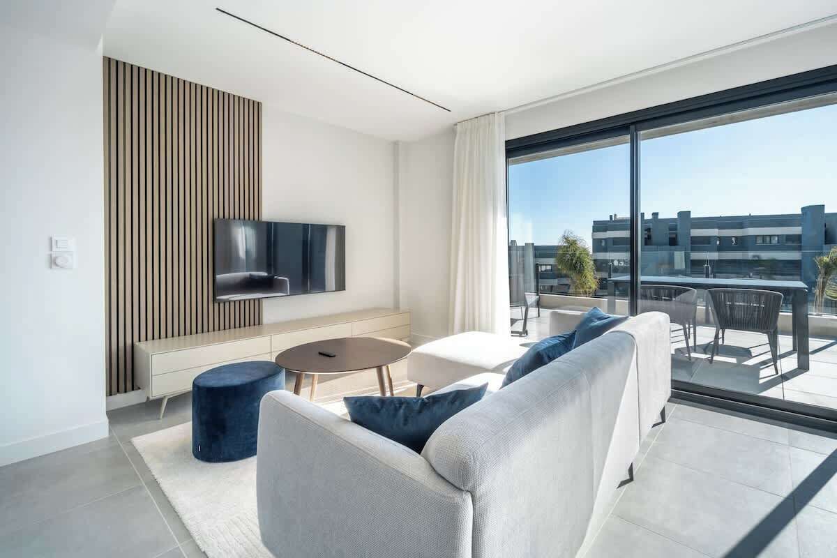 
Bright and cozy living room with comfortable seating.