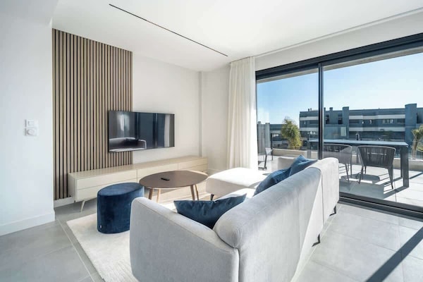 Bright and cozy living room with comfortable seating.