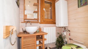 A wooden cabin bathroom with a sink, mirror, and shower. - LA GRANGE AU CORPS (Gussignies)