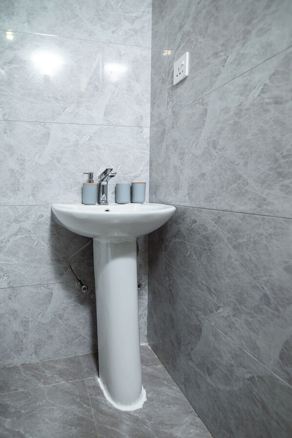 Shower, towels, soap, toilet paper