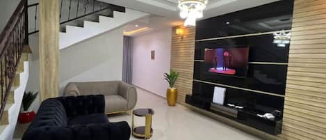 Chambre Deluxe, balcon, vue ville | Coin séjour