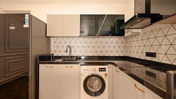 Fridge, stovetop, electric kettle, cookware/dishes/utensils