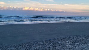 A beach with waves and a clear sky. - 2 BR 2 BA Royal Poste condo in Sea Trail Resort Sunset Beach, NC (Sunset Beach)