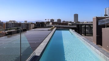 Outdoor pool, open 7:00 AM to 11:00 PM, pool loungers