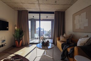 Two Bedroom | Living area | Smart TV, Netflix, streaming services - THREE43 on B - Fluent Serviced Apartments (Cape Town)
