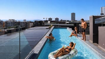 Outdoor pool, open 7:00 AM to 11:00 PM, pool loungers