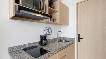 Apartment (VL02I) | Private kitchen | Griddle, cookware/dishes/utensils, cleaning supplies, dining tables