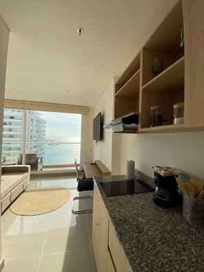 Apartment | Private kitchen | Griddle, cookware/dishes/utensils, cleaning supplies, dining tables - U-GO Edificio Eira (Santa Marta)