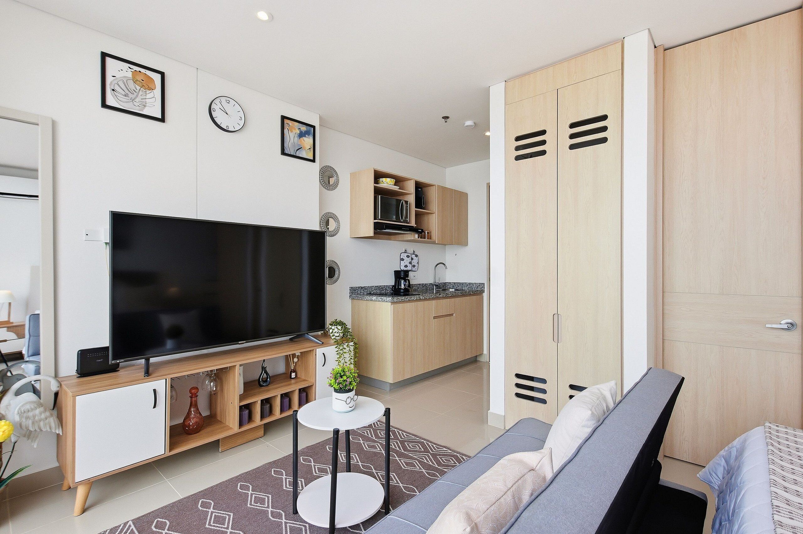 City Apartment | Living area | 52-inch Smart TV with digital channels