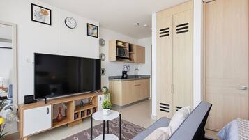 City Apartment | Living area | 52-inch Smart TV with digital channels