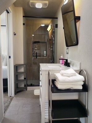 Shower, hair dryer, towels, soap