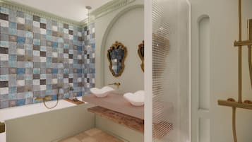 Un baño con pared de mosaicos, un lavabo blanco y una zona de ducha.