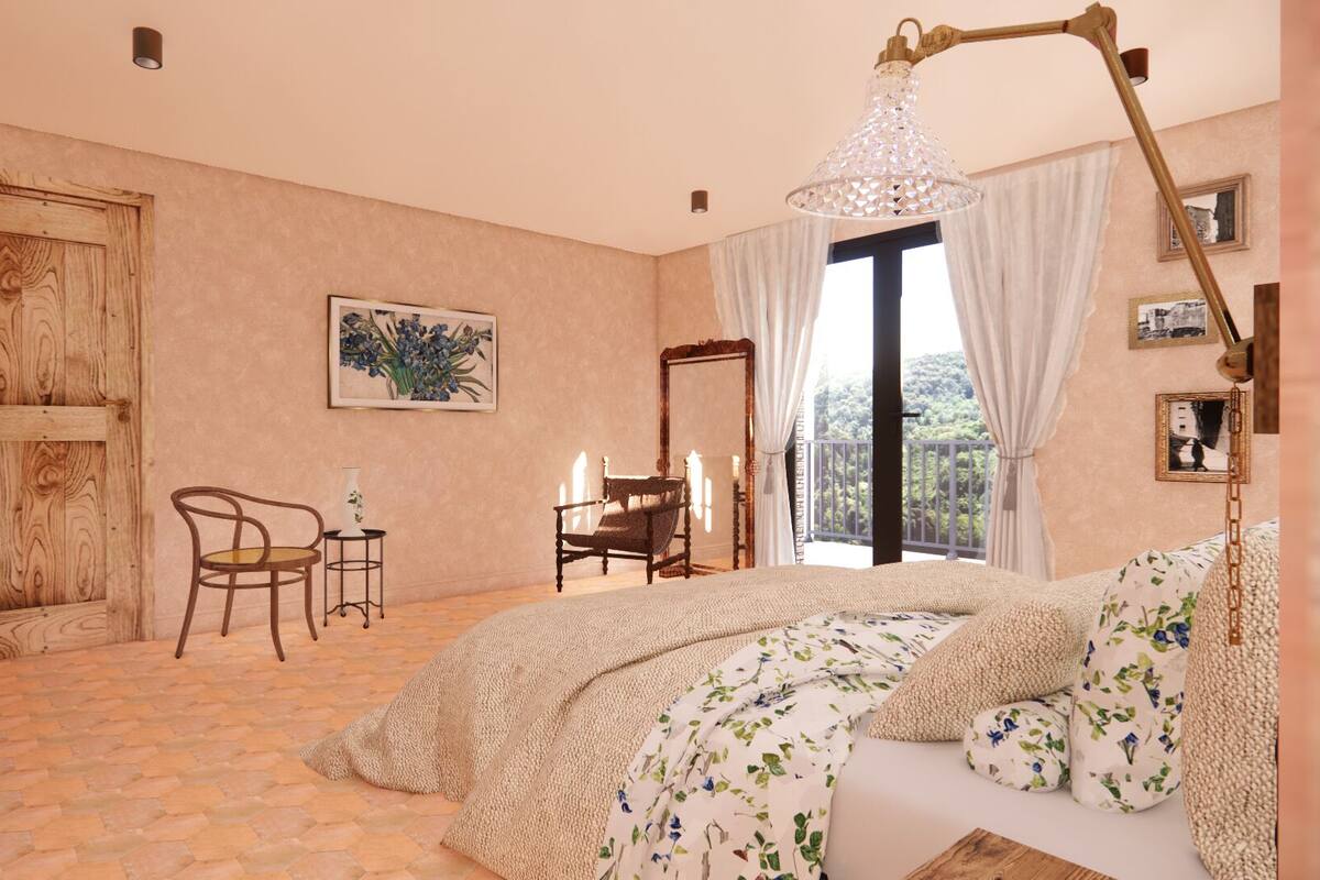 Un dormitorio con una cama grande, una silla, una mesa y un cuadro en la pared.