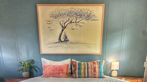 A bedroom with a large bed, a framed artwork of a tree, and a fluffy rug. - Zen 10, relax and retreat in the heart of Vermont (Manchester)