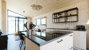 Fridge, dishwasher, coffee/tea maker, dining tables