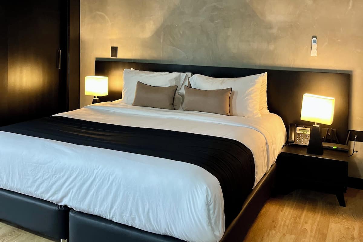 Exclusive Suite, Garden View | 1 bedroom, hypo-allergenic bedding, in-room safe, iron/ironing board