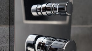A modern bathroom with a chrome faucet and a control panel. - House of Al-Ay Künzelsau (Künzelsau)