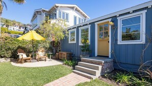 A single-story house with a front porch, a yellow umbrella, and a small garden. -  Avail  this Dec 1st  2026. (Laguna Beach)