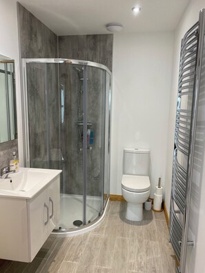 Shower, hair dryer, towels, soap