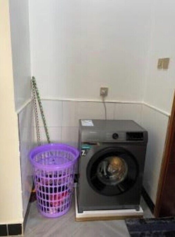 Convenient laundry facilities include a front-loading washing machine.
