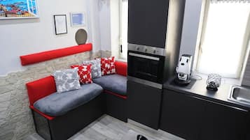 Family Room, Balcony | Private kitchen