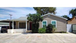 A single-story house with a garage, a covered porch, and a driveway. - Affordable + Pet Friendly 1 BR + sofa bed/1BA #B (Lubbock)