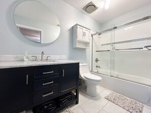 Shower, hair dryer, towels, soap