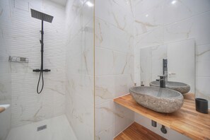 Shower, hair dryer, towels, toilet paper