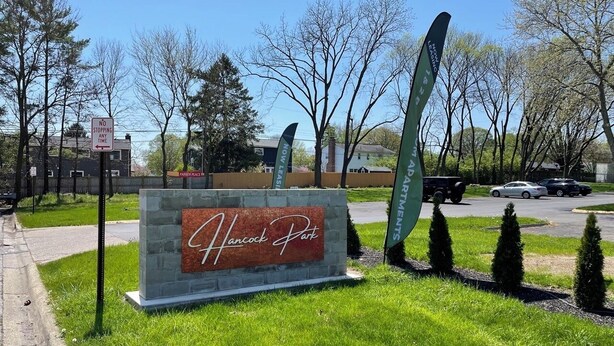 A sign for Hancock Park with a 'No Stopping Any Time' sign nearby. - Furnished Resort Style Apartment w/ WIFI & Parking (Columbus)