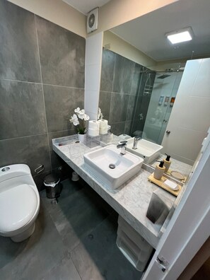 Shower, hair dryer, towels, soap