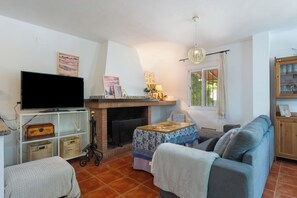 TV, fireplace - Rural House 'Las Nubes' with Mountain Views, Wi-Fi, and Air Conditioning (Cortegana)