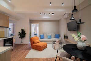 Comfort Apartment, 2 Bedrooms, Balcony | Living area | 42-inch Smart TV with cable channels, Netflix, streaming services - Playful & Trendy 2BR on Regina Elisabeta, Steps to Cismigiu Gardens | Bathtub & Boulevard Views (Bucharest)
