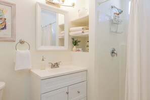 Shower, hair dryer, towels, soap