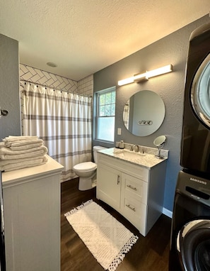 Hair dryer, towels, soap, toilet paper