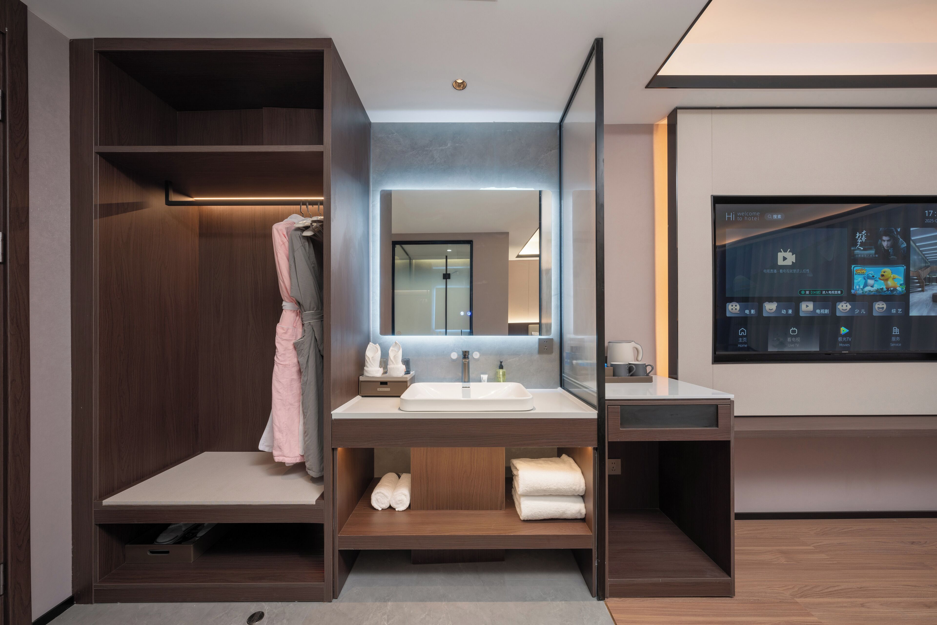 A modern bathroom with a vanity, a mirror, and a built-in shower.