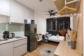Signature Dual Key Studio | Desk, laptop workspace, blackout drapes, iron/ironing board