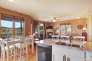 Enjoy cooking in this well-appointed kitchen with a large island, dishwasher, and stunning views of the surrounding landscape.